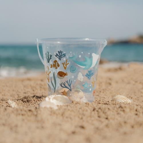 Little Dutch Beach Bucket Ocean Dreams Blue on the sand with shells