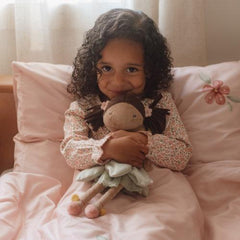 Child cuddling Little Dutch Fairy Doll Evi