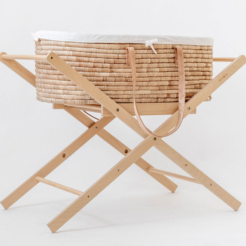 Ko-Coon foldable Moses stand holding a Moses basket