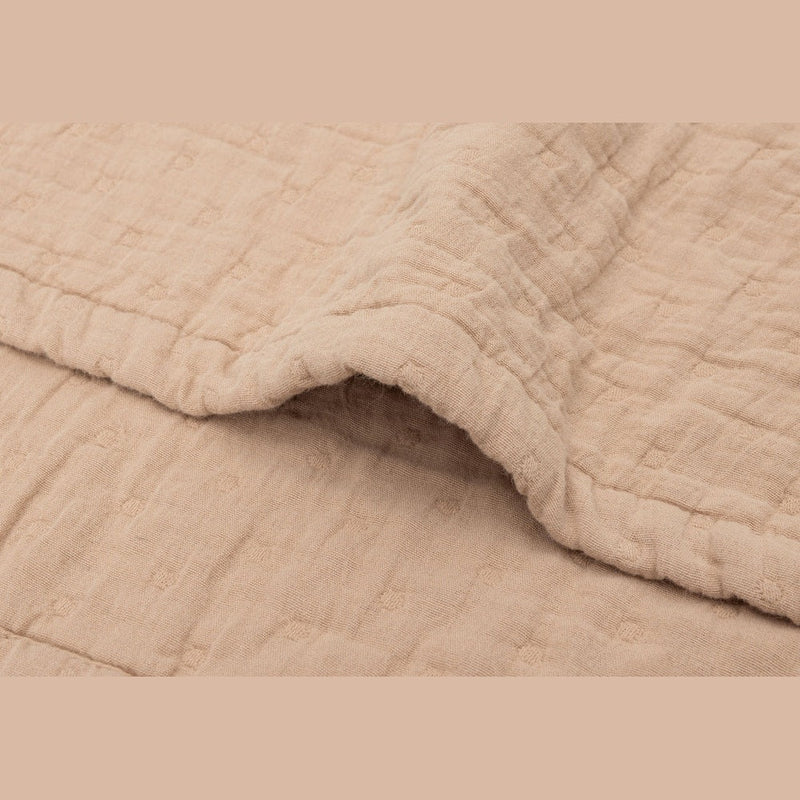Close up of the Jollein Biscuit jacquard muslin