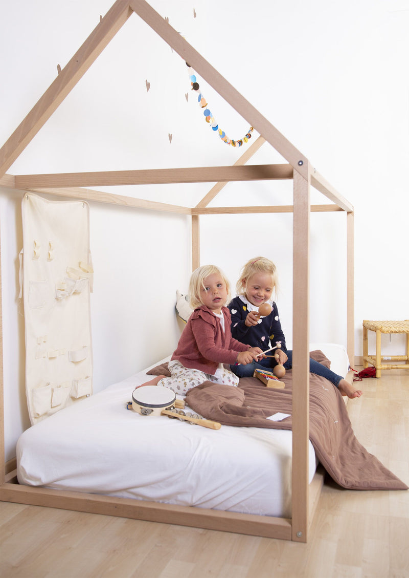 Childhome house bed frame styled in a children's bedroom