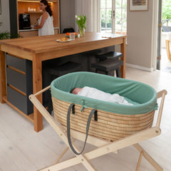 Ko-Coon foldable Moses stand with basket in a kitchen