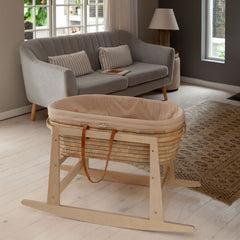Ko-Coon rocker with Moses basket in a living room