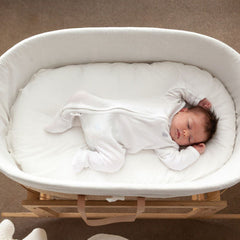 Baby sleeping on a Ko-Coon milky white slipcover