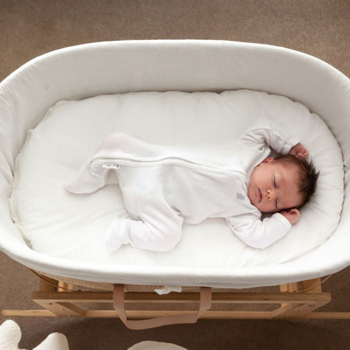 Baby sleeping on a Ko-Coon milky white slipcover