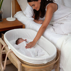 Ko-Coon merino mattress in a Moses basket beside the bed