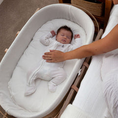 Ko-Coon slipcover on the mattress in a Moses basket