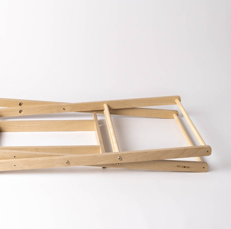 Ko-Coon foldable Moses stand folded flat for storage