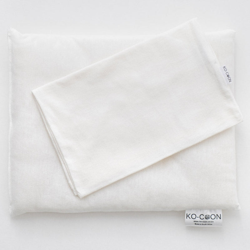 Ko-Coon milky white baby pillowcase folded