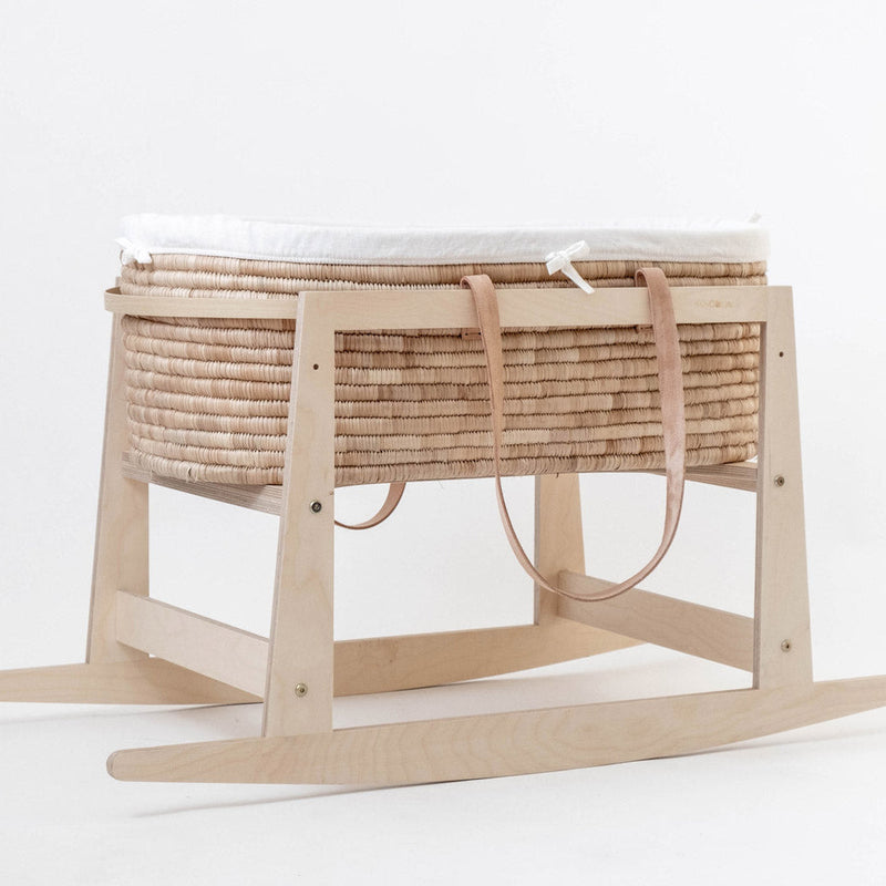 Ko-Coon rocker holding a Moses basket